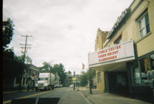 A photo of a movie theater marquee on a main street in PA