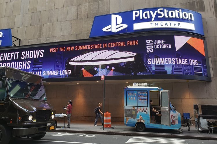 A digital banner featuring an animated stage graphic promoting the 2019 SummerStage season at the Playstation Theater in NY